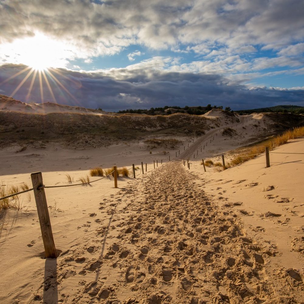 Dunes in the Slowinski National Park. Landscape with beautiful sky, clouds and dunes in the sun. Czolpino, Leba, Poland.
